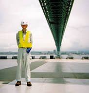 Simon standing on one of the caissons of Akashi-Kaikyo Bridge, Japan.